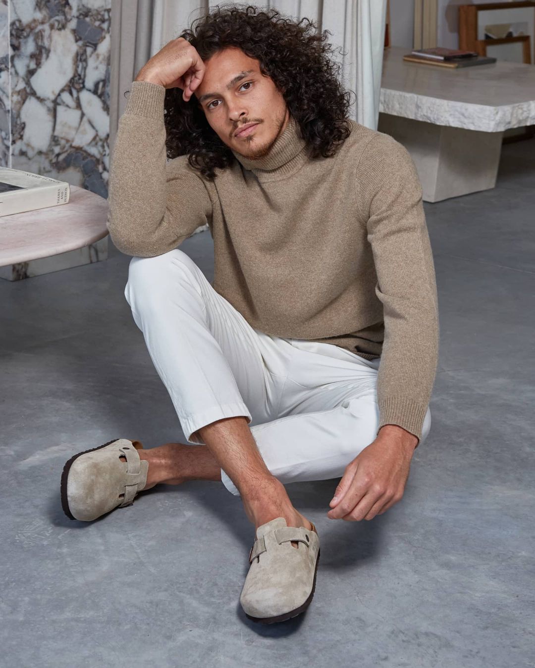 Male model is sitting on the floor